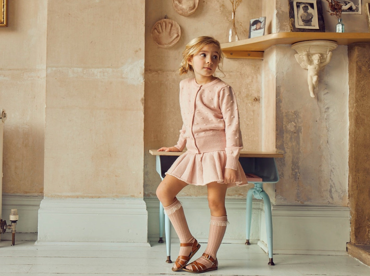 This stylish 4 ply cardigan comes with gentle puff sleeves, a long bottom rib to accentuate the waist, and lots and lots of Bobbles. After all, who doesn’t LOVE Bobbles? A fun addition to any winter wardrobe, it is made with the softest cashmere/merino blend from Inner Mongolia, and will keep your Little One stylish and warm all winter long.