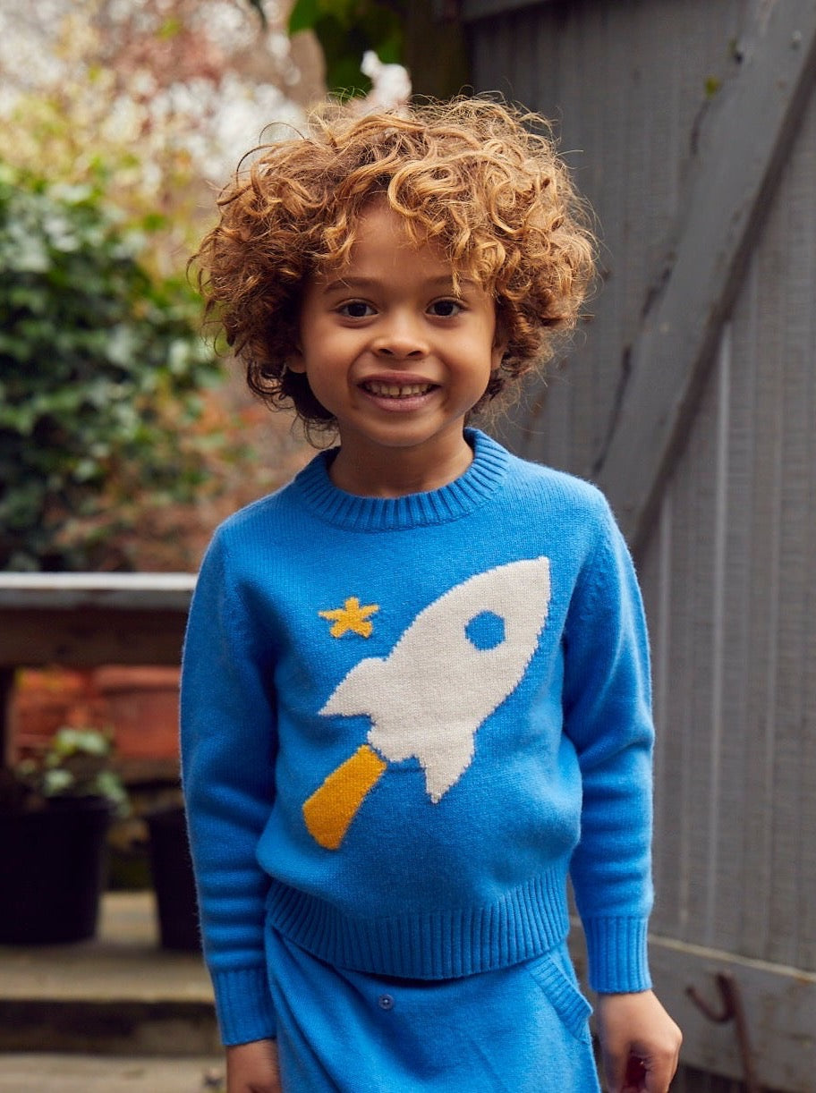 Zoom, zoom, zoom, we’re going to the moon. Jet off into space with our cosy little Rocket Jumper which will appeal to all young space lovers! Made with the softest cashmere/ merino blend from Inner Mongolia, it will keep you Little One cosy and warm all winter long. Team it up with our matching Boy Pants in Bright Blue for a head-to-toe cosy feel.