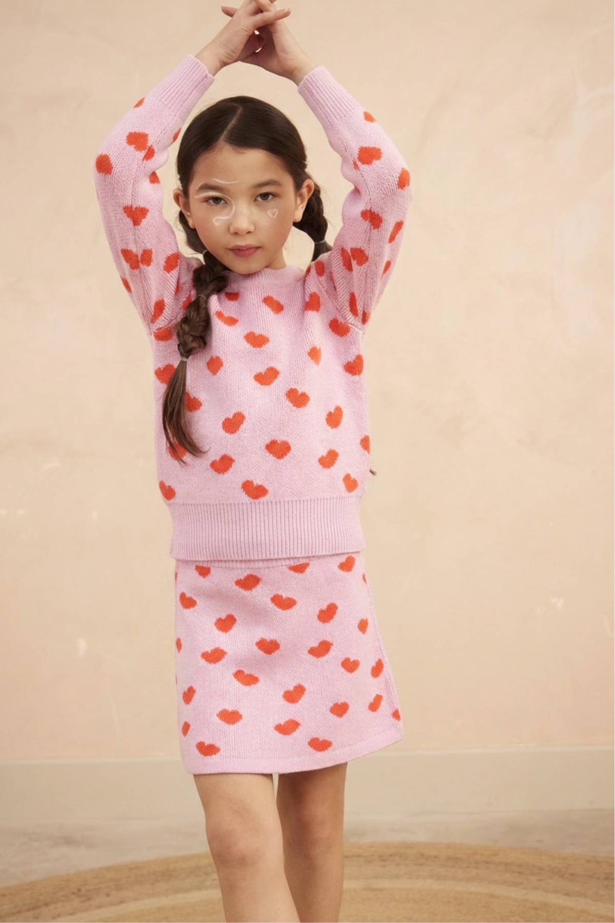 Front view of the bubble gum Love Hearts Jumper from MIKA & MILO with rib neckline