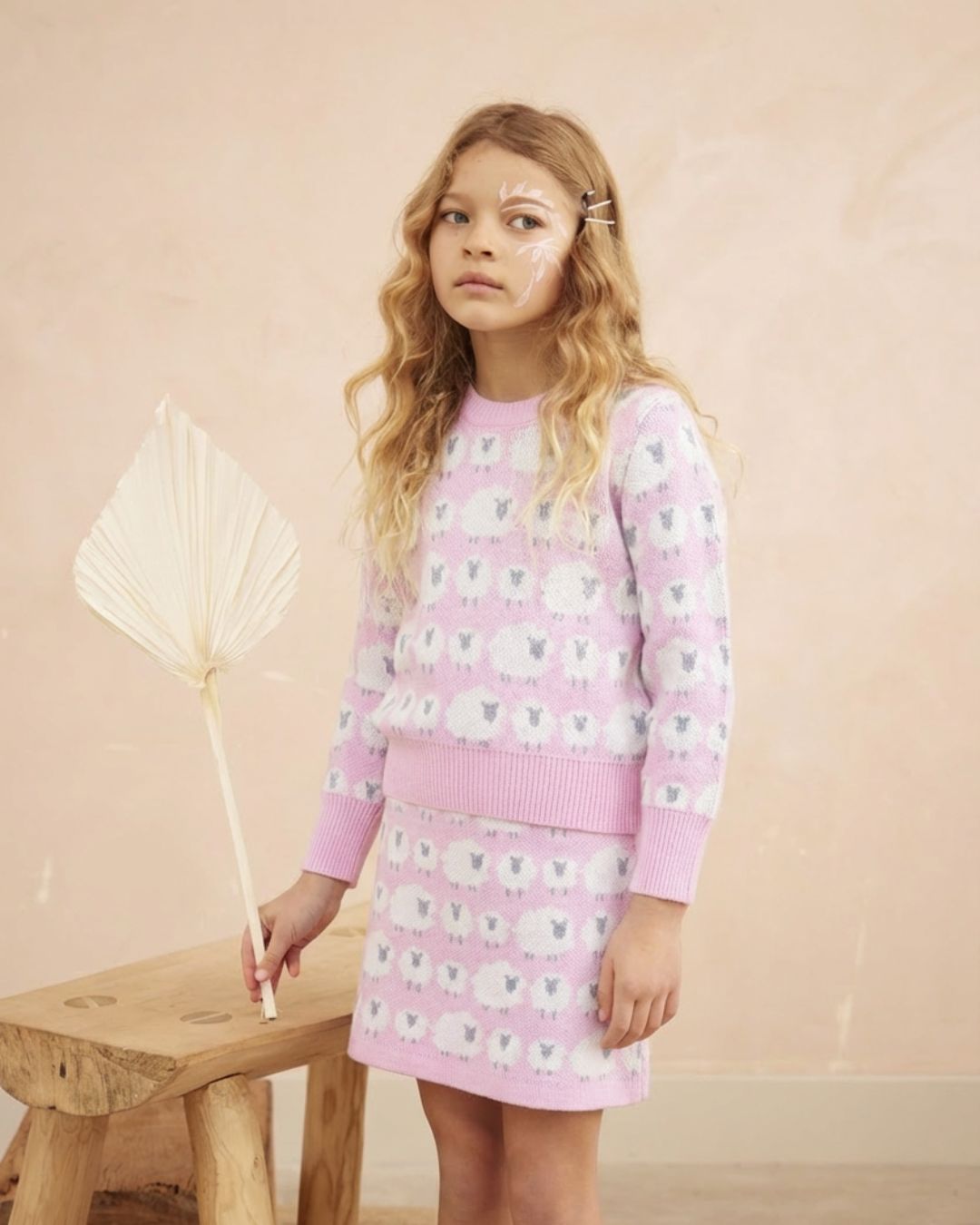 Detail of the jacquard sheep on the bubble gum Little Bo Peep Jumper from MIKA & MILO