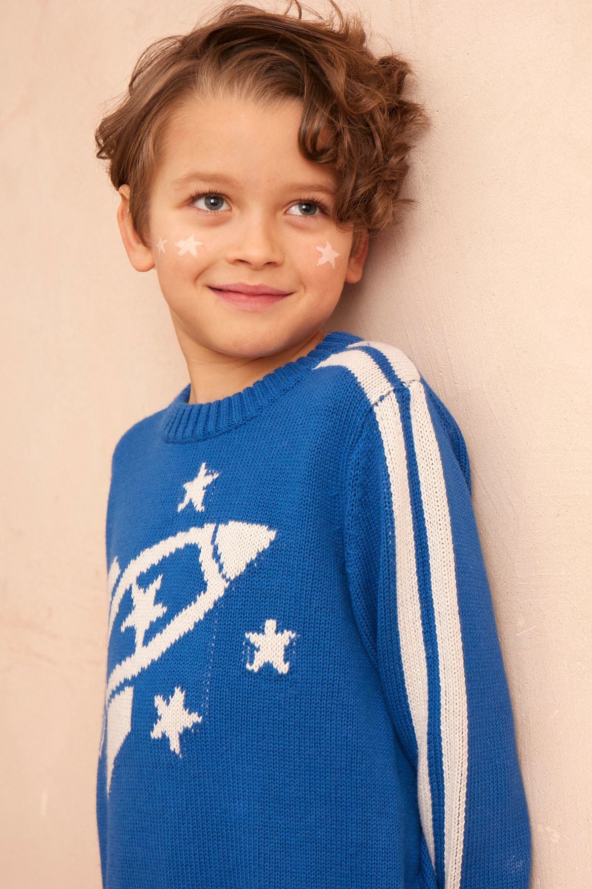 Boy in the cobalt Striped Rocket Jumper from MIKA & MILO, intarsia knit in organic cotton and cashmere
