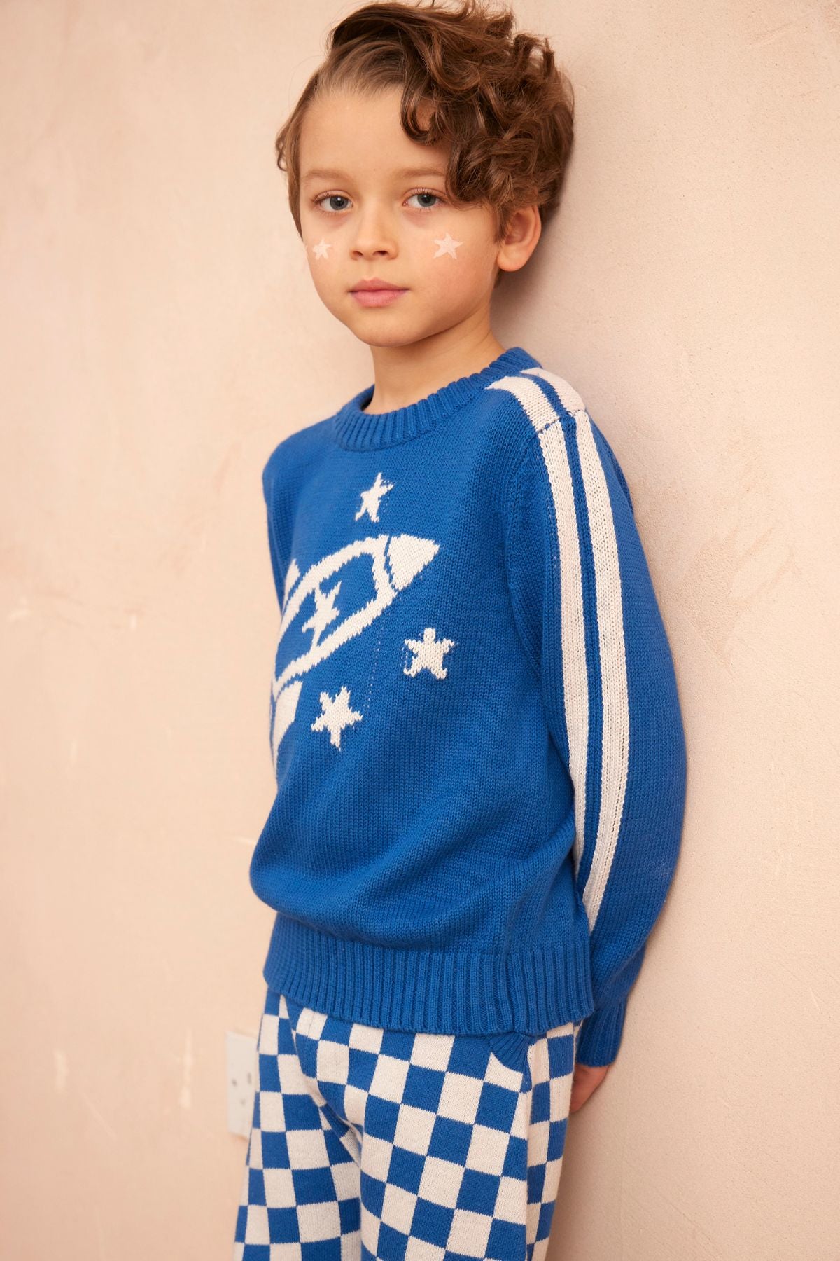 Front view of the cobalt Striped Rocket Jumper from MIKA & MILO showing the intarsia rocket detail