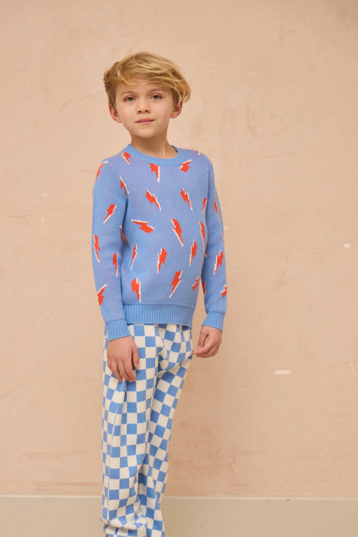 Boy wearing the Bolt Storm Jumper in azure blue