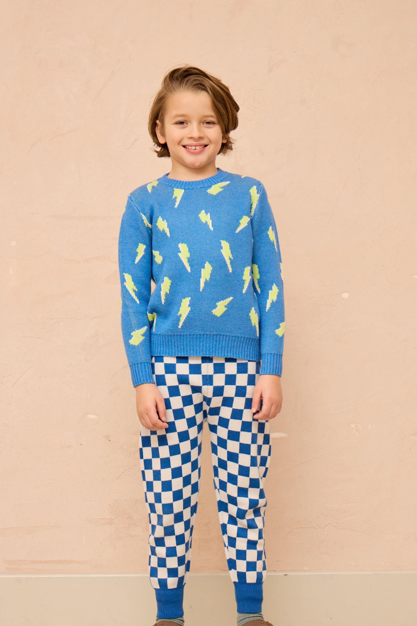 Boy wearing the MIKA & MILO Bolt Storm Jumper in hussar blue