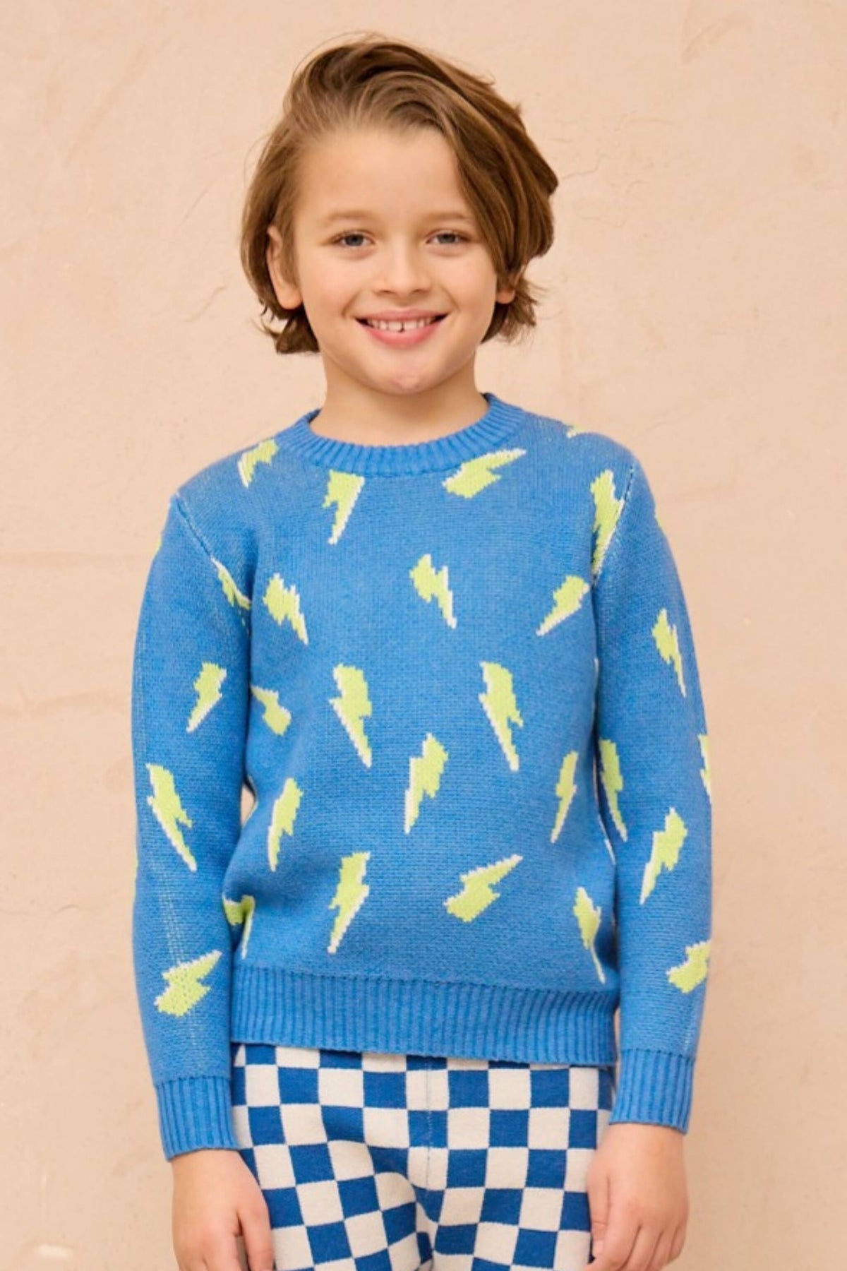 Boy wearing the Bolt Storm Jumper in hussar blue