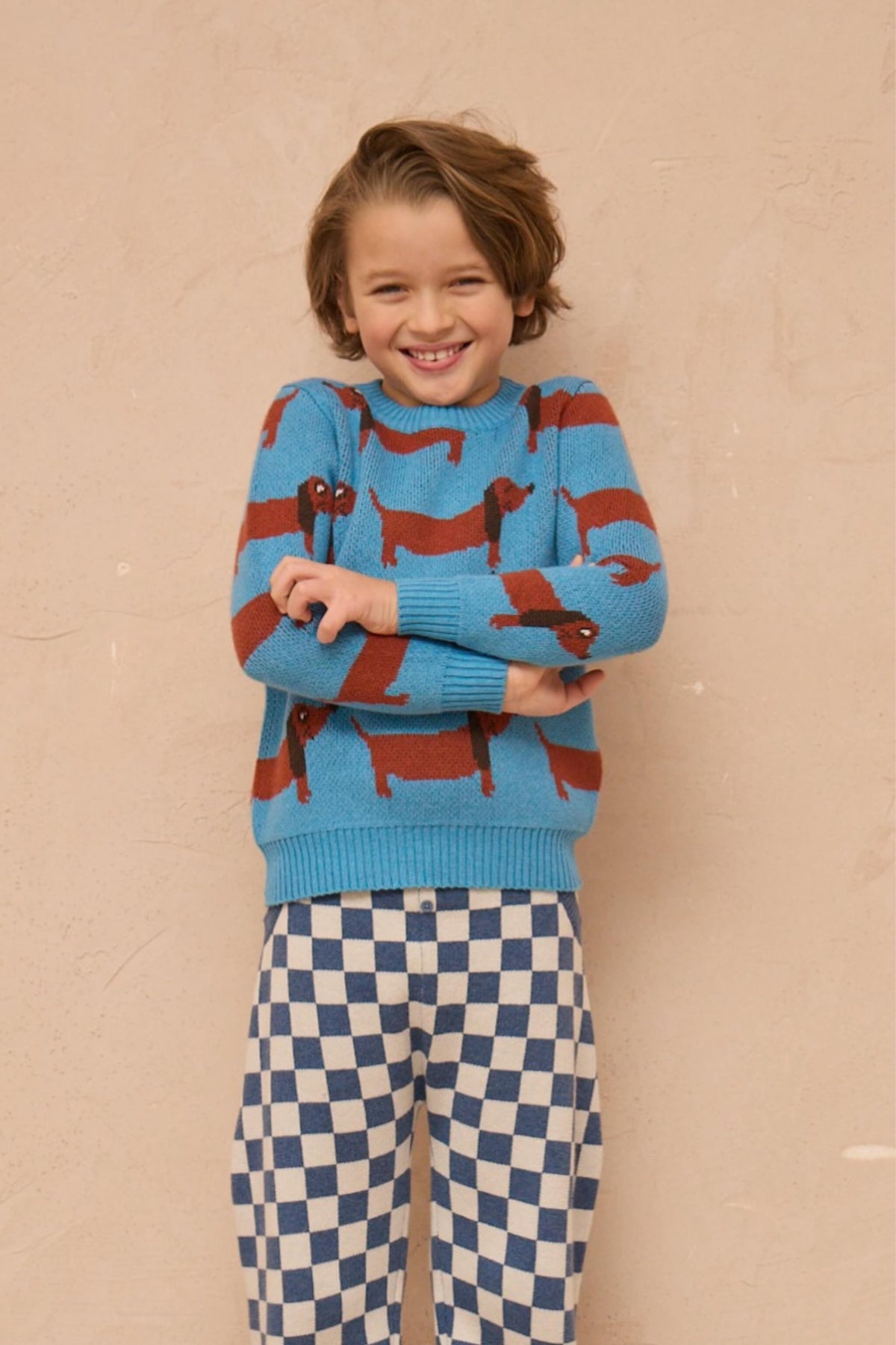 Boy wearing the MIKA & MILO Dachshund Jumper in Iceland blue