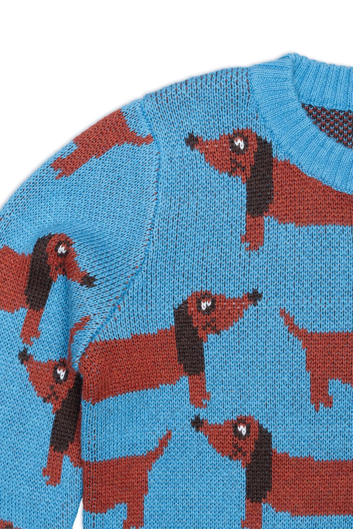 Close-up of the knitted dachshunds on the Iceland blue jumper
