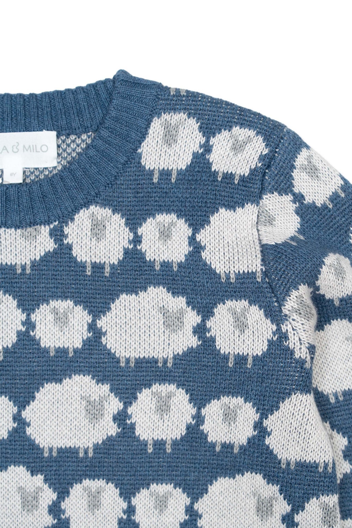 Close-up of the jacquard-knit sheep on the bluestone blue jumper