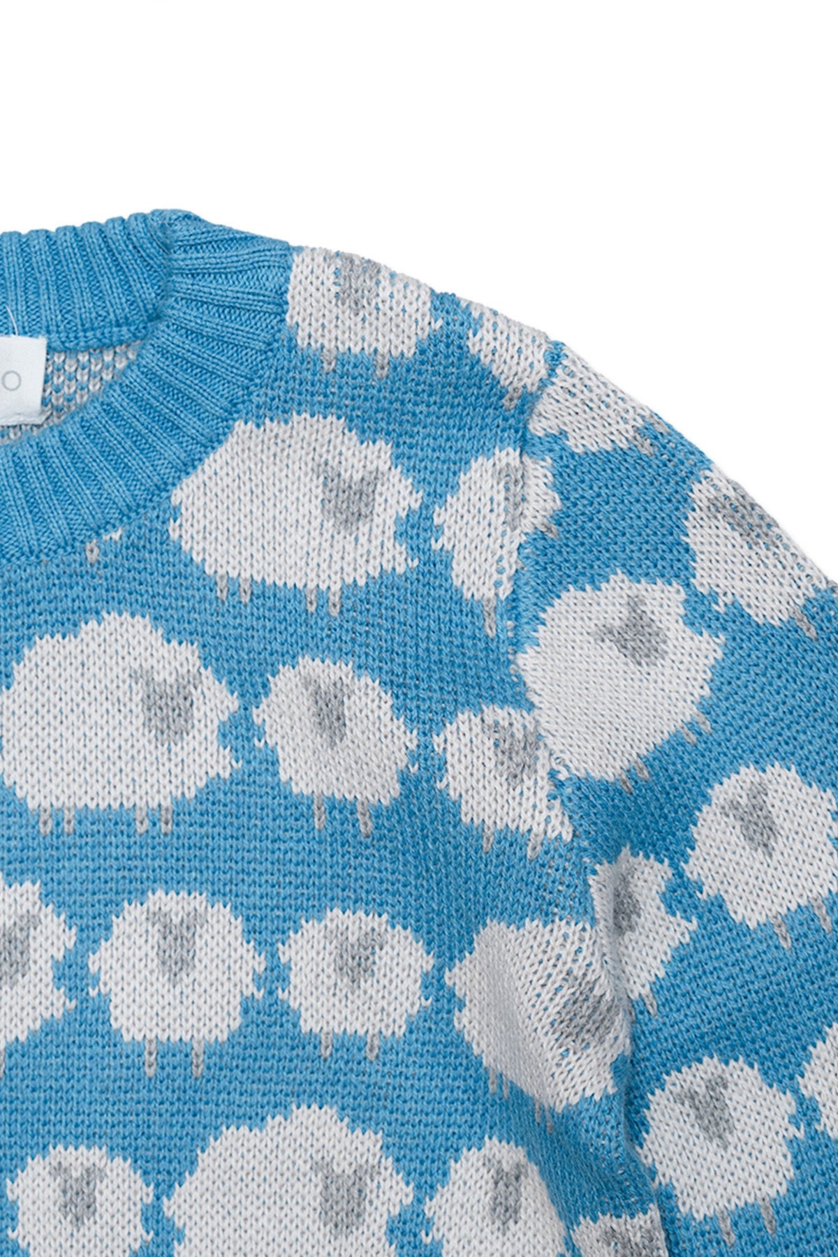 Close-up of the jacquard-knit sheep on the Iceland blue jumper
