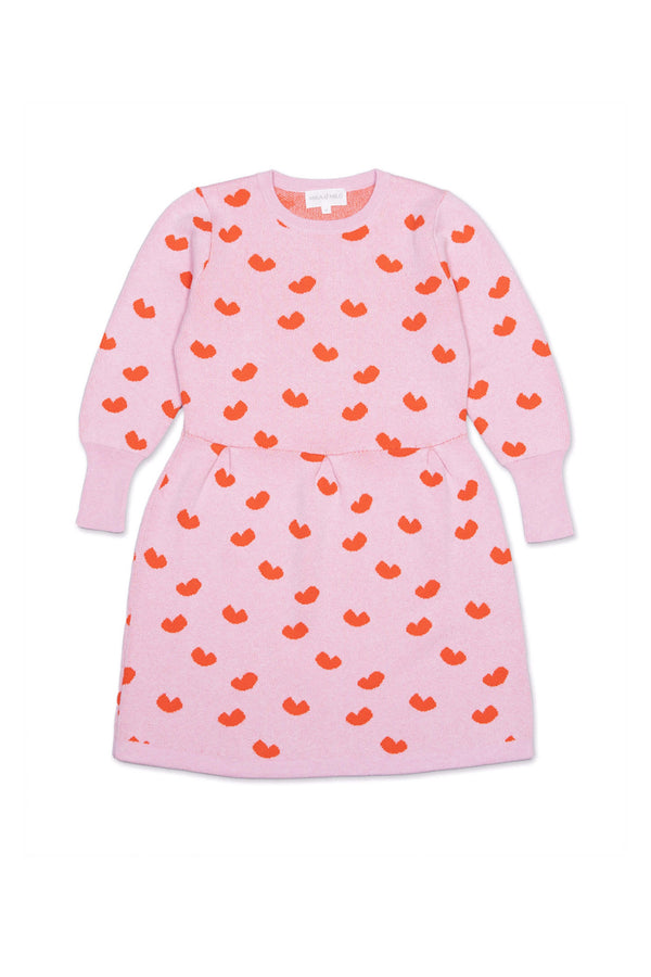Front view of the Love Hearts Dress in bubble gum pink with lolly pop red jacquard hearts and a pleated waist