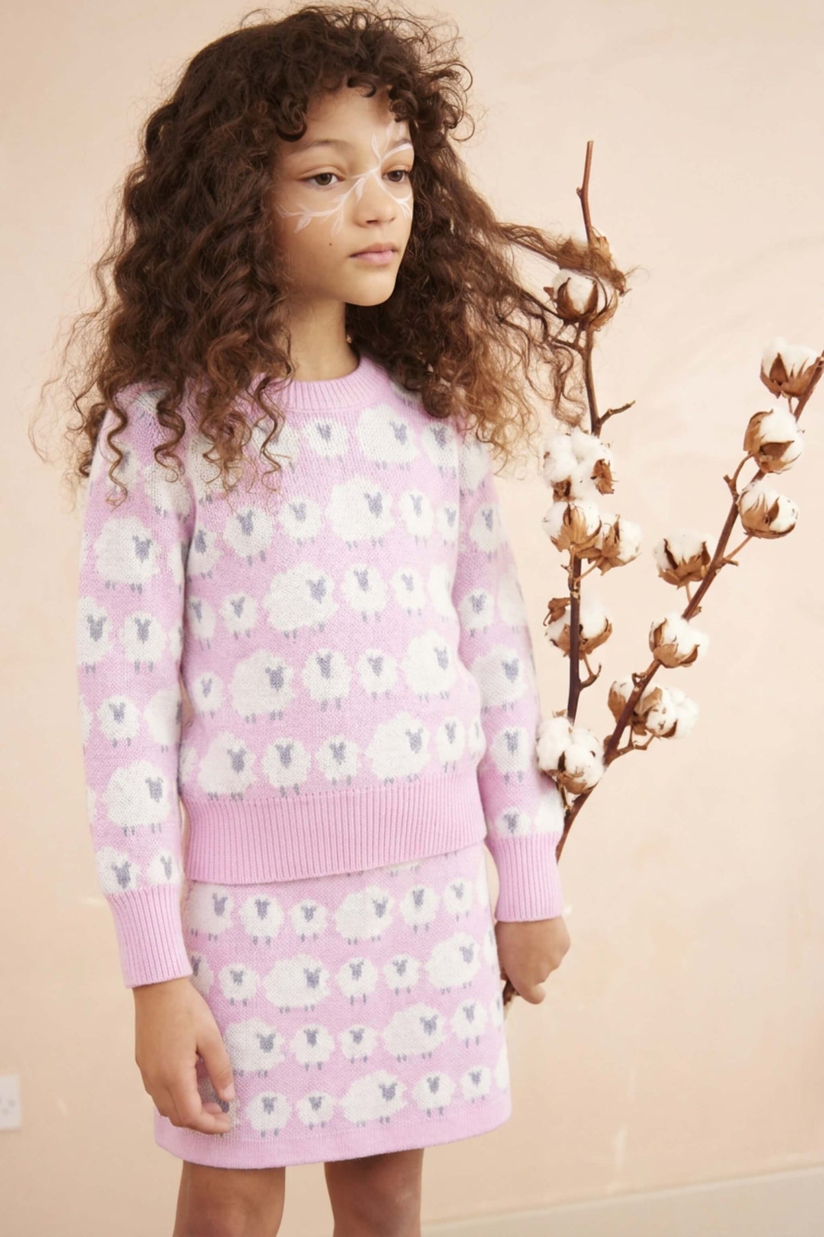 Girl wearing the MIKA & MILO Little Bo Peep jumper and skirt set in bubble gum pink