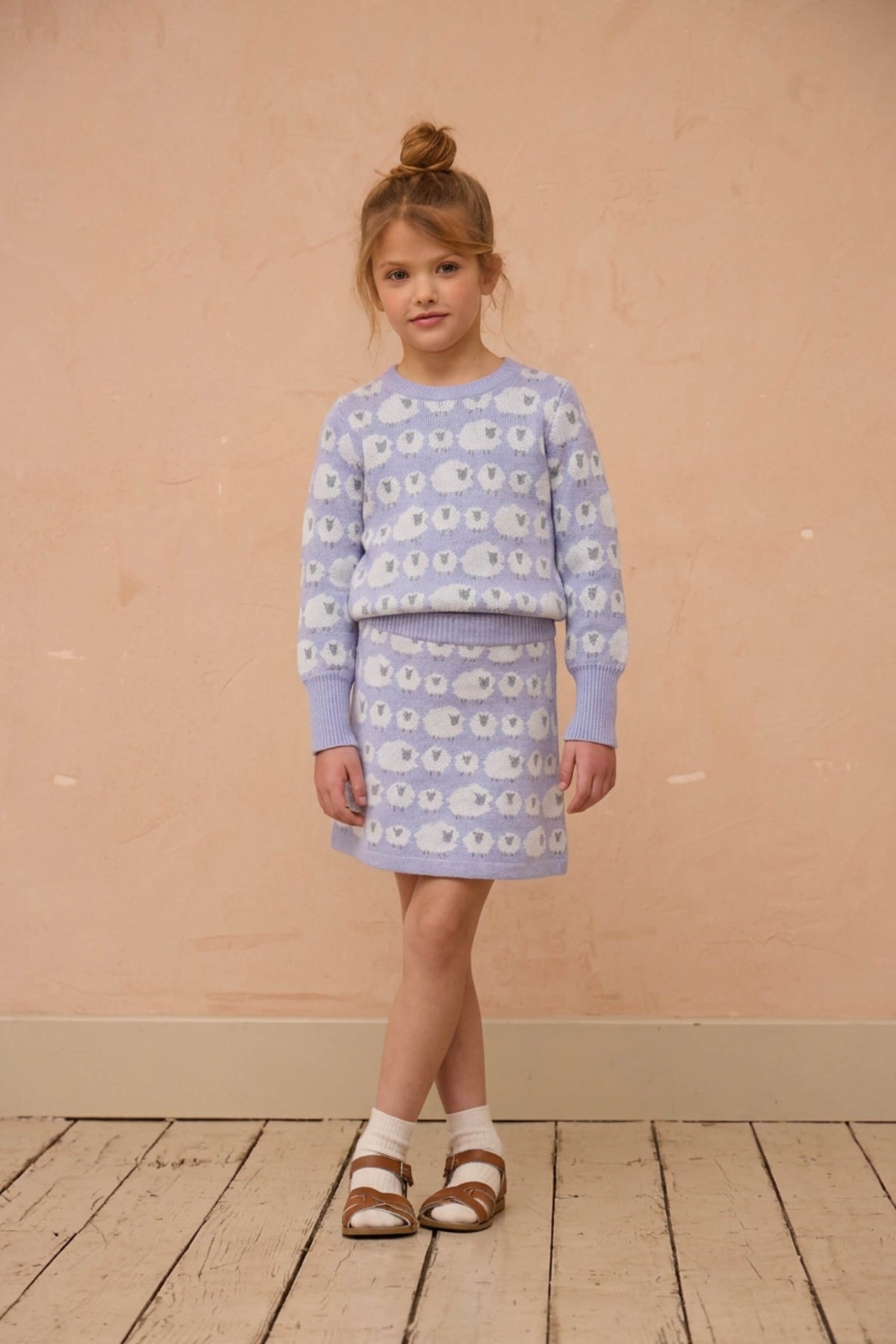 Girl wearing the MIKA & MILO Little Bo Peep jumper and skirt set in lavender
