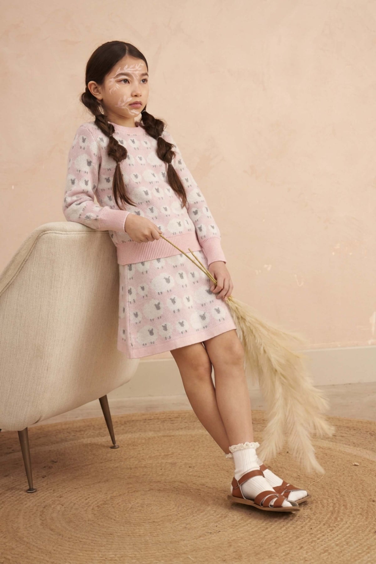 Girl wearing the Little Bo Peep Skirt in rose pink