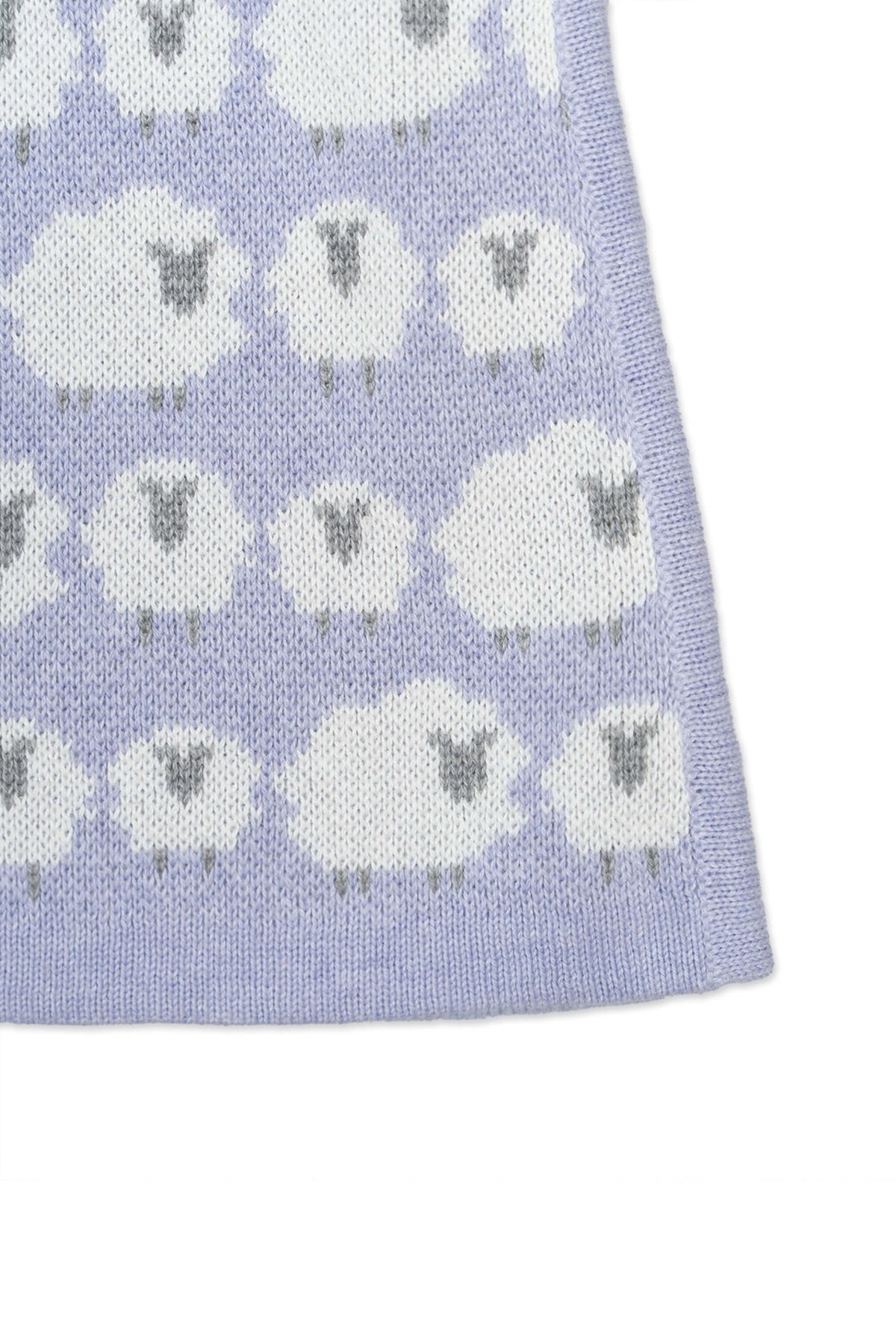 Close-up of the jacquard-knit sheep on the lavender skirt