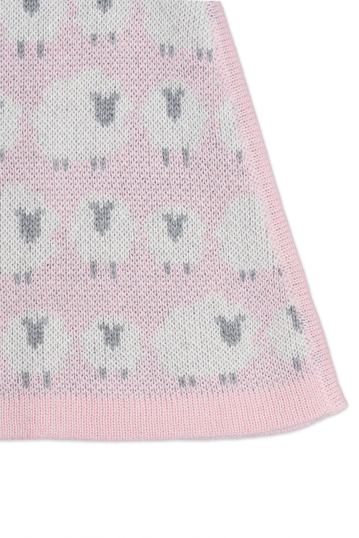 Close-up of the jacquard-knit sheep on the rose pink skirt