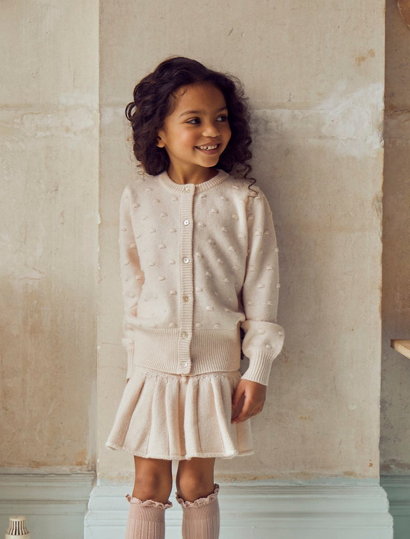 This thick 8 ply pleated Tennis Skirt comes with snuggly bloomers attached underneath. Made with the softest cashmere/super soft merino blend from Inner Mongolia, it will keep your Little One cosy and warm all winter long.